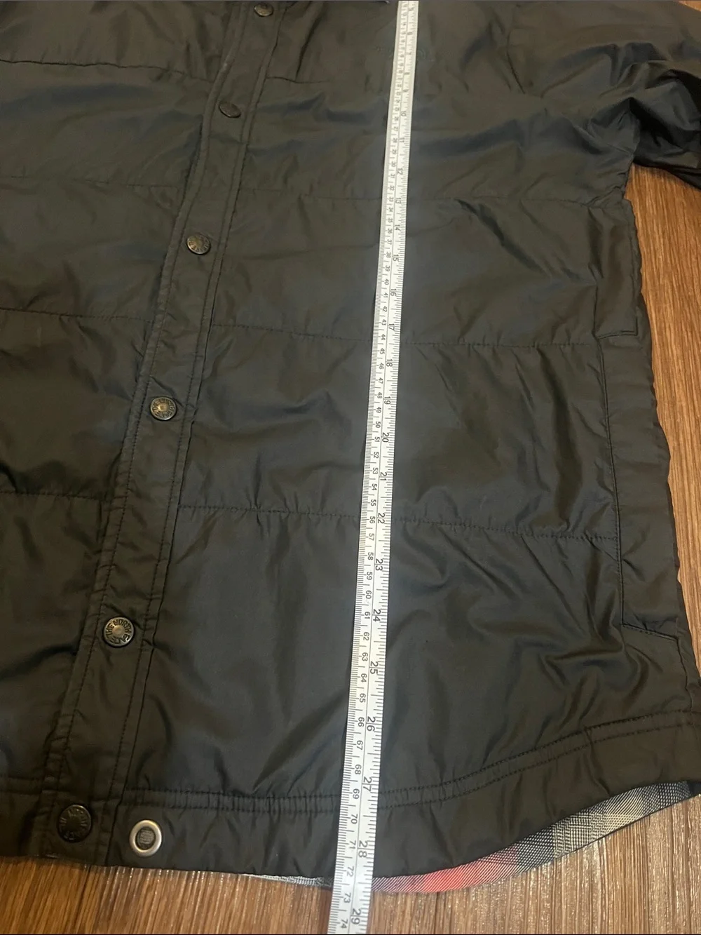 The North Face Black Jacket with Red & Blue Plaid Lining can be worn inside-out